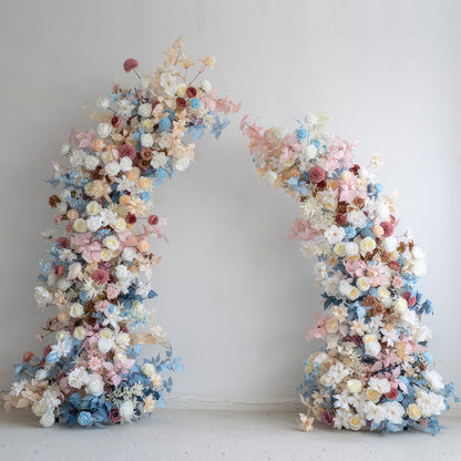 This flower - covered arch showcases a pastel symphony of soft blues, pinks, whites, and warm earthy tones. It combines roses, dahlias, and other blossoms, creating a romantic and dreamy style. Ideal for weddings, events, and photoshoots to add a touch of charm. 