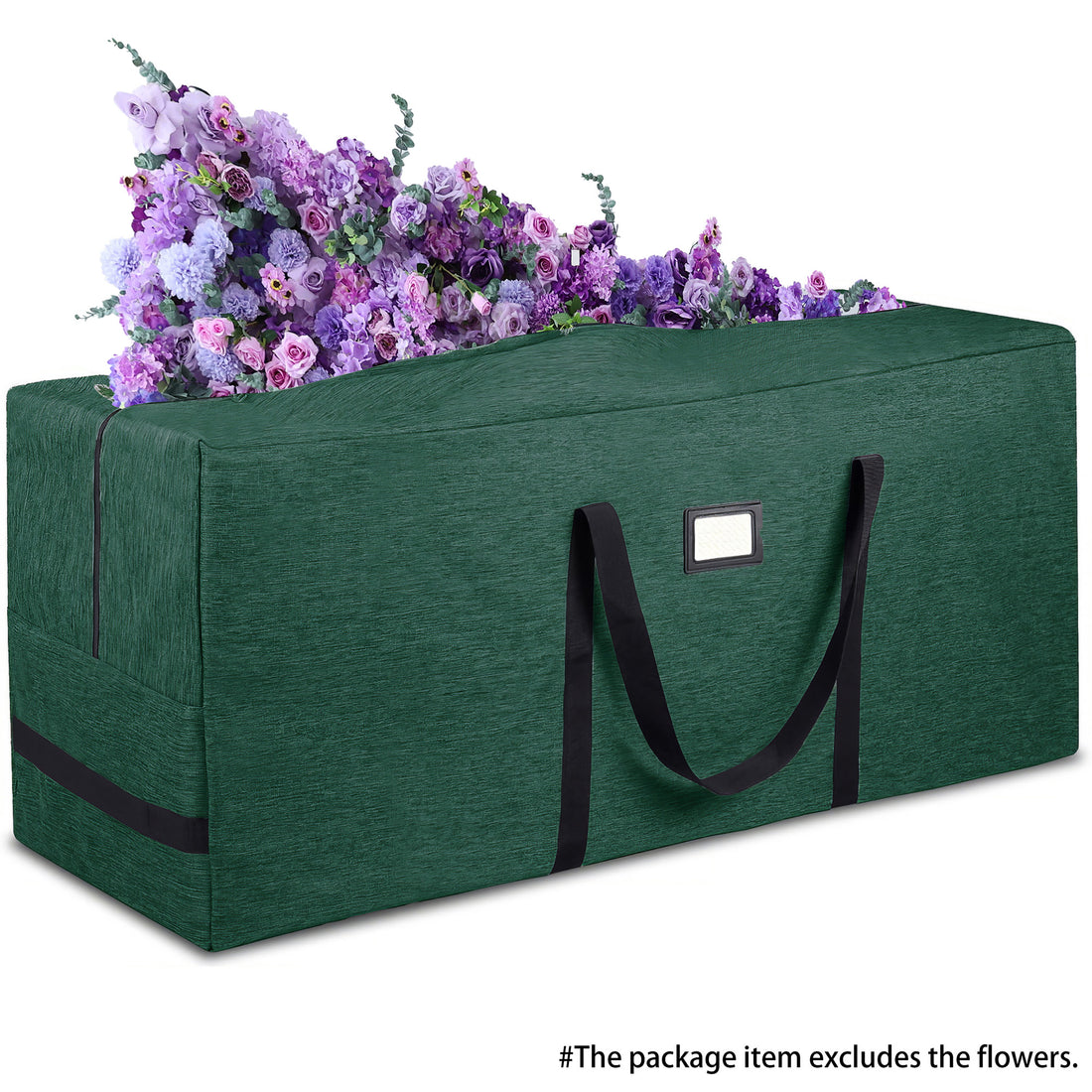 This image shows a large, dark green storage bag with black handles and a rectangular label patch on its side. The bag appears to be made of a durable fabric, likely for carrying or storing items. At the top of the bag, there is a display of colorful artificial flowers in various shades of purple and pink. Notably, a caption at the bottom indicates that “The package item excludes the flowers,” clarifying that the flowers are not part of what is being sold.