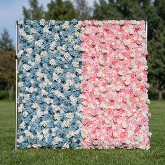 Split two-tone artificial flower wall mounted on a metal backdrop stand outdoors on green grass. Left side features dusty blue hydrangeas and white roses; right blends blush, peach and pale pink roses. Dense full blooms, reusable and low-maintenance. Ideal for baby showers, gender reveal parties, wedding photo booths, boutique decor and pastel-themed social media shoots.