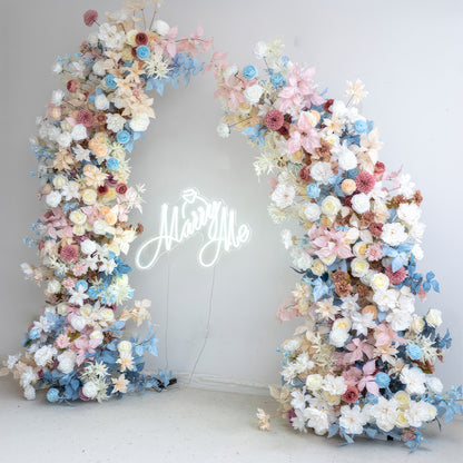 This flower - filled arch is a vision of beauty, featuring a palette of soft blues, pinks, whites, and hints of earthy tones. It combines roses, dahlias, and other blooms. The romantic and dreamy style makes it perfect for weddings, proposals, and photoshoots. 