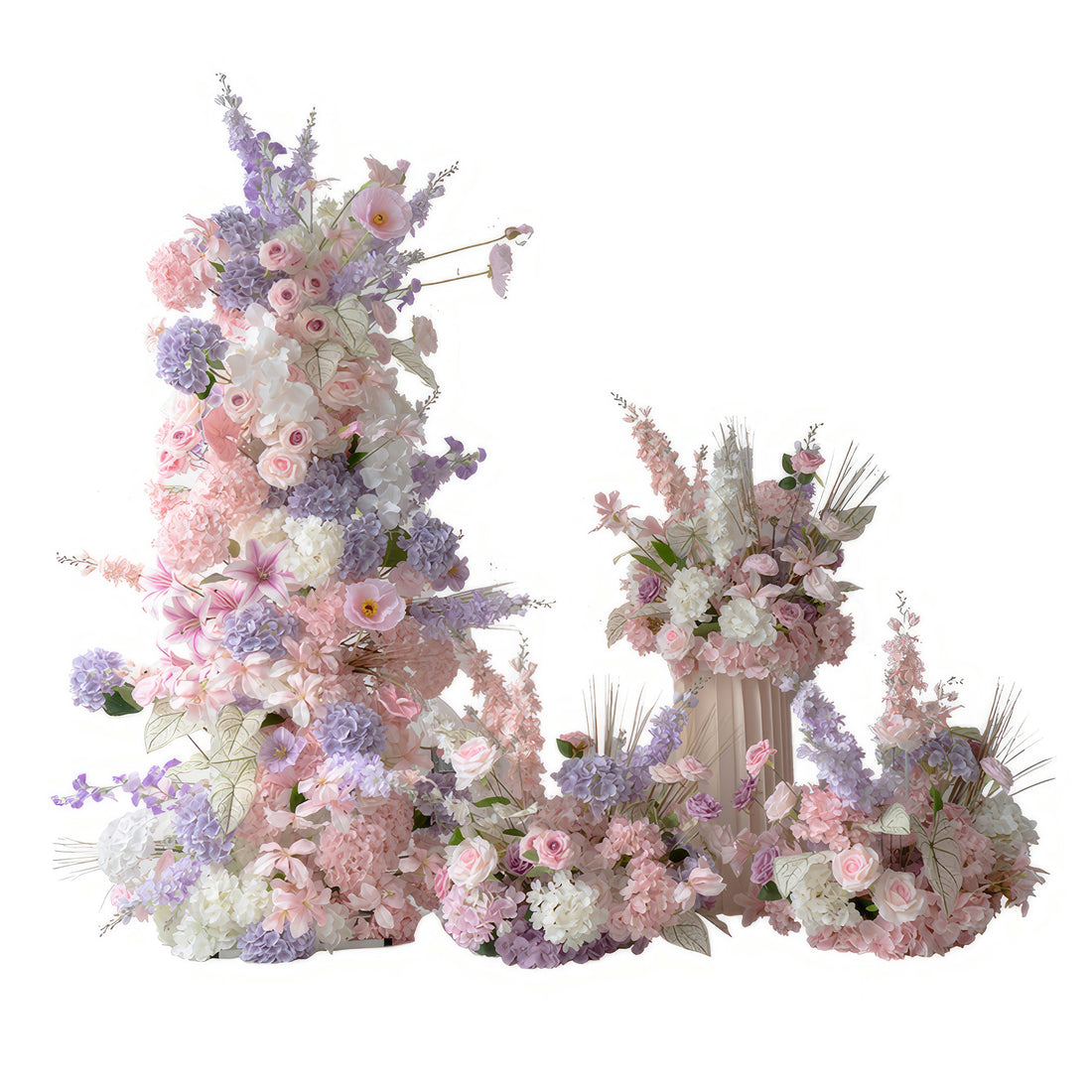 This collection of floral arrangements showcases a charming blend of pastel colors, including soft pink, lavender, and white. Comprising various artificial flowers like roses, hydrangeas, and some delicate blooms, it exudes a romantic and dreamy atmosphere. The tall vertical piece, along with the smaller arrangements on the ground and in the vase, creates a visually appealing and harmonious setup, perfect for enhancing the decor of weddings, engagement parties, or other romantic events. 