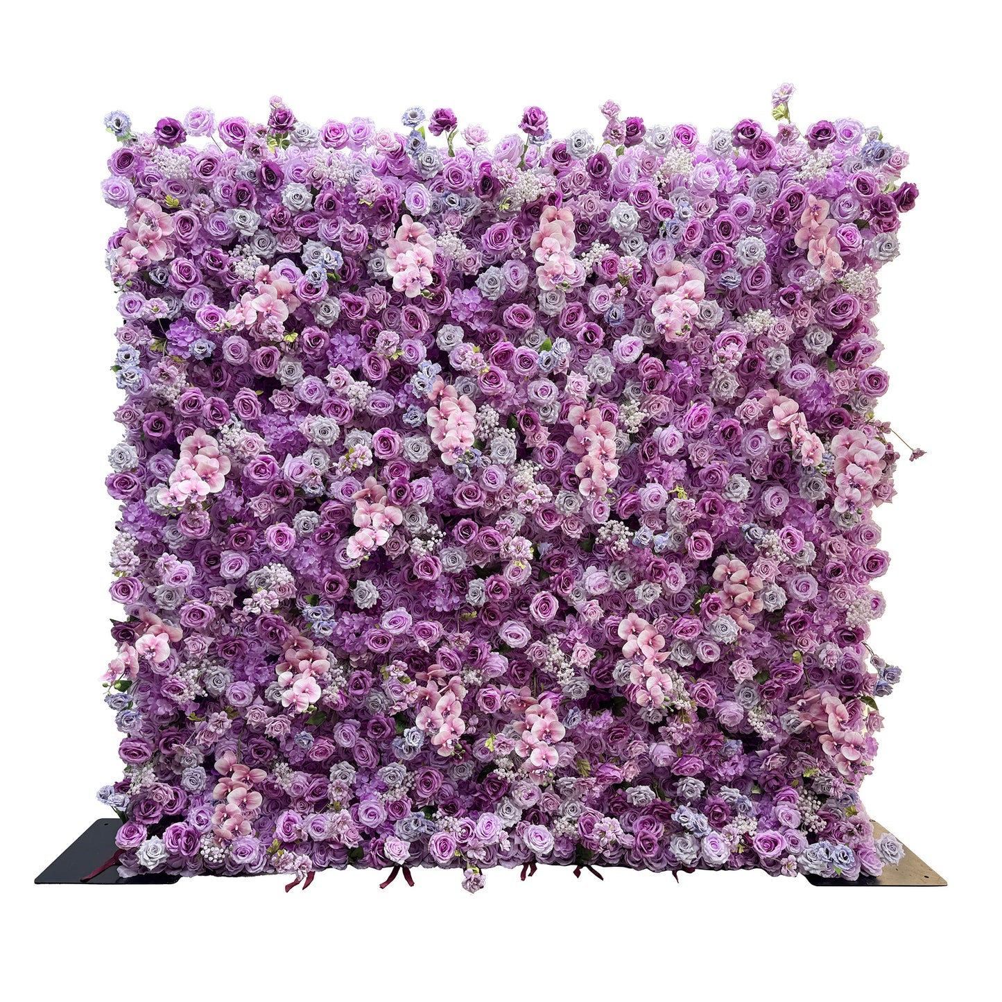 This image features a flower wall densely packed with artificial flowers. Predominant flowers include roses in various shades of purple, lavender, and light pink, interspersed with clusters of smaller white and pink blossoms. The color palette creates a harmonious blend of cool tones, giving it a romantic and elegant style, perfect for events like weddings or photo - backdrops. 