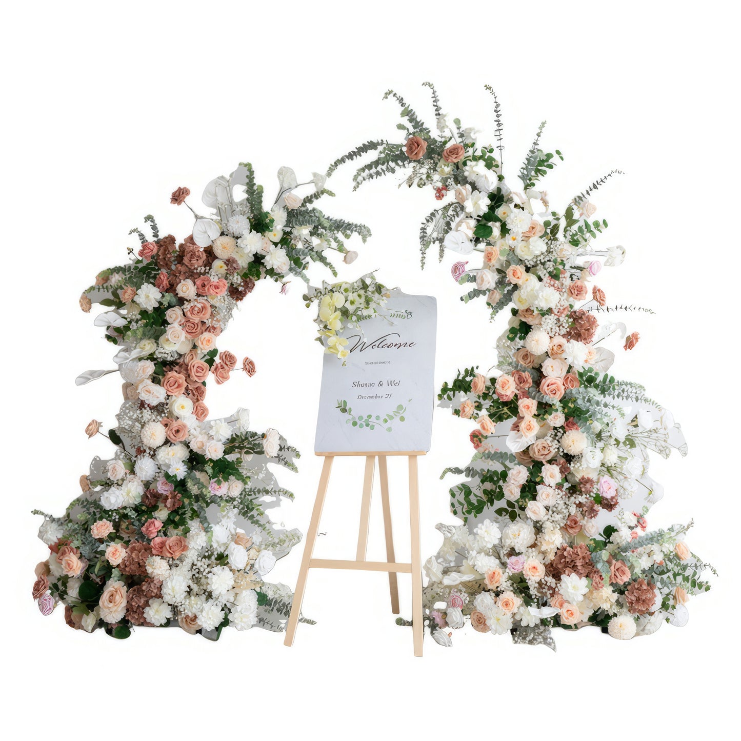 A romantic, asymmetrical floral arch from Valar Flowers, crafted with a soft, warm palette of blush pink, terracotta, and creamy white blooms—including roses, peonies, and delicate baby's breath—intertwined with silvery eucalyptus and lush greenery. A "Welcome" sign on a wooden easel rests between the arch, creating a dreamy, elegant, and sophisticated aesthetic ideal for luxury weddings and editorial photoshoots.