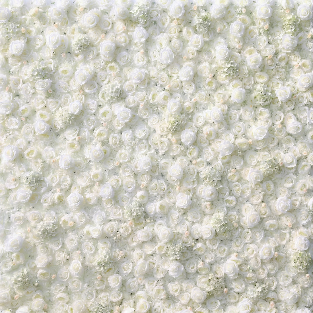 This lush, close-up view showcases a dense, wall-to-wall arrangement of artificial white roses and delicate filler blooms, creating a soft, velvety texture. The uniform, luminous white palette and intricate layering of petals evoke timeless elegance and romance, making it a luxurious backdrop for weddings, engagement photos, or upscale event decor that exudes pure sophistication.