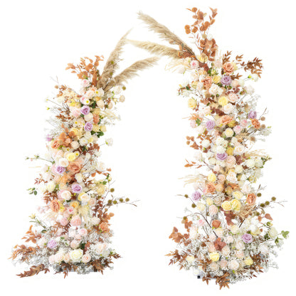 This is a stunning floral arch made of artificial flowers. It is adorned with roses in soft pastel colors like pink, lavender, and peach, along with white blooms. Pampas grass and brownish - orange leaves add a natural touch, creating a warm, romantic, and bohemian - style decoration. 