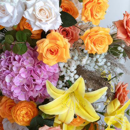 This is a vivid and eye - catching flower arrangement. It combines bright yellow lilies, orange and peach - toned roses, large purple hydrangeas, and white roses. There are also white baby&