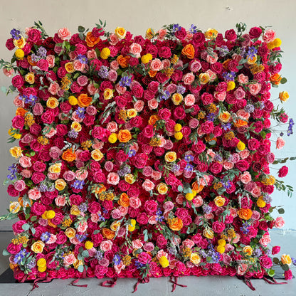 This artificial flower wall is a stunning piece. It is densely packed with a variety of colorful flowers, including vibrant roses, delicate lilies, and charming daisies. The flowers are complemented by lush green leaves, creating a rich and lively appearance. It is perfect for weddings, parties, or any event, providing a beautiful and eye - catching backdrop.