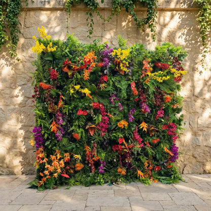 This Valar Flowers tropical flower wall backdrop bursts with vibrant, layered blooms and lush green foliage—featuring fiery orange anthuriums, deep red roses, sunny yellow sprays, rich purple orchids, and ferns. Set against a rustic stone wall, it creates a bold, exotic focal point ideal for tropical weddings, summer parties, and lively photo opportunities, blending natural vibrancy with eye-catching color.