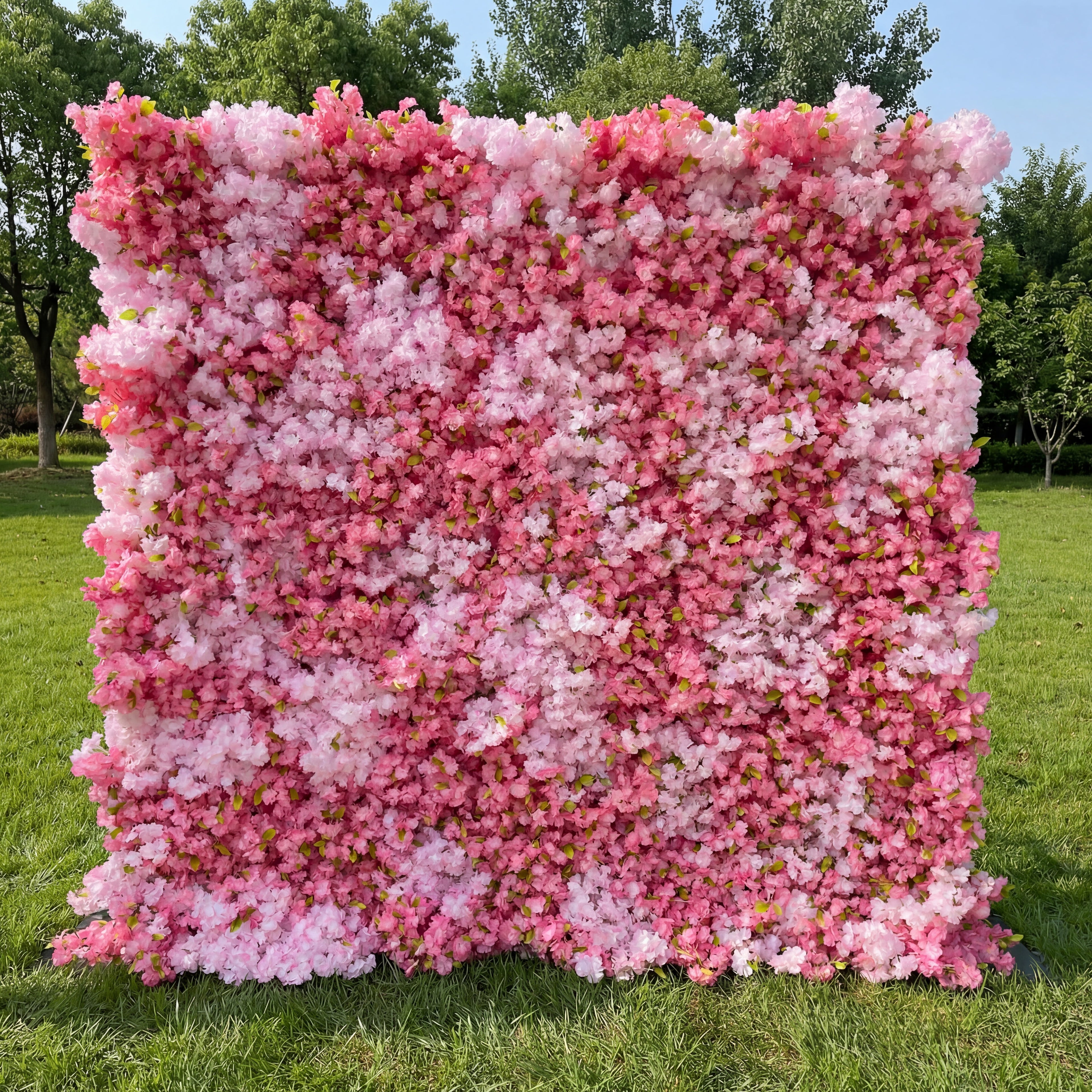 Valar Flowers premium artificial cherry blossom flower wall backdrop, a dense, lush floral panel featuring a gradient of soft pink, blush, and ivory white cherry blossoms with vibrant green foliage. This lifelike, UV-resistant floral wall creates a dreamy, romantic, ethereal aesthetic, perfect for outdoor weddings, spring events, bridal showers, engagement photos, birthday parties, and luxury event photo booth backdrops.