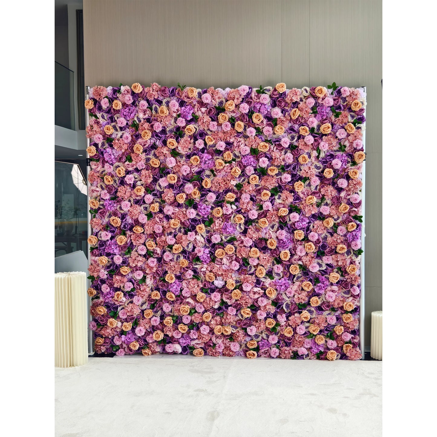 This flower wall is a dense and vibrant display of artificial flowers. It features a harmonious blend of purple, pink, and light peach - colored roses and hydrangeas. The rich color palette and lush arrangement create a romantic and elegant atmosphere, making it an ideal backdrop for weddings, photo - shoots, or events, exuding a sense of charm and sophistication. 