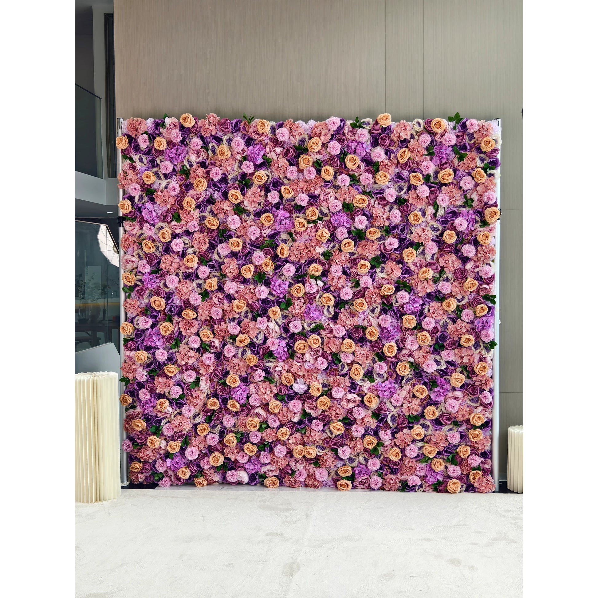 This flower wall is a dense and vibrant display of artificial flowers. It features a harmonious blend of purple, pink, and light peach - colored roses and hydrangeas. The rich color palette and lush arrangement create a romantic and elegant atmosphere, making it an ideal backdrop for weddings, photo - shoots, or events, exuding a sense of charm and sophistication. 