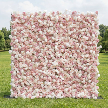 A romantic, gradient floral wall by Valar Flowers stands on lush green grass, transitioning from creamy white at the top to soft blush pink at the bottom. Densely packed with delicate roses and peonies, it creates a seamless, textured surface. This elegant, pastel design is perfect for outdoor weddings, bridal showers, or feminine-themed photo backdrops, radiating warmth and timeless charm.