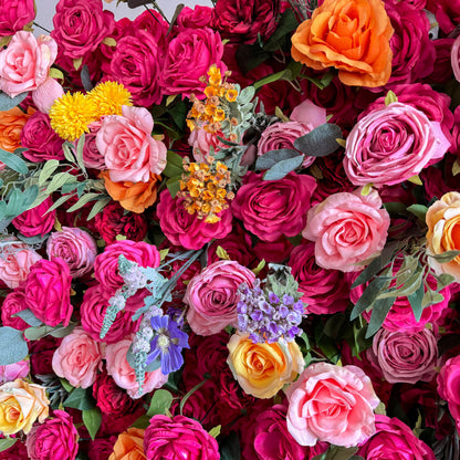 This artificial flower wall is a vibrant and luxurious decoration. It features a rich variety of colorful flowers, including roses in different hues. The flowers are densely arranged with green leaves, creating a lush and three - dimensional appearance. It is perfect for adding a romantic and festive atmosphere to events.