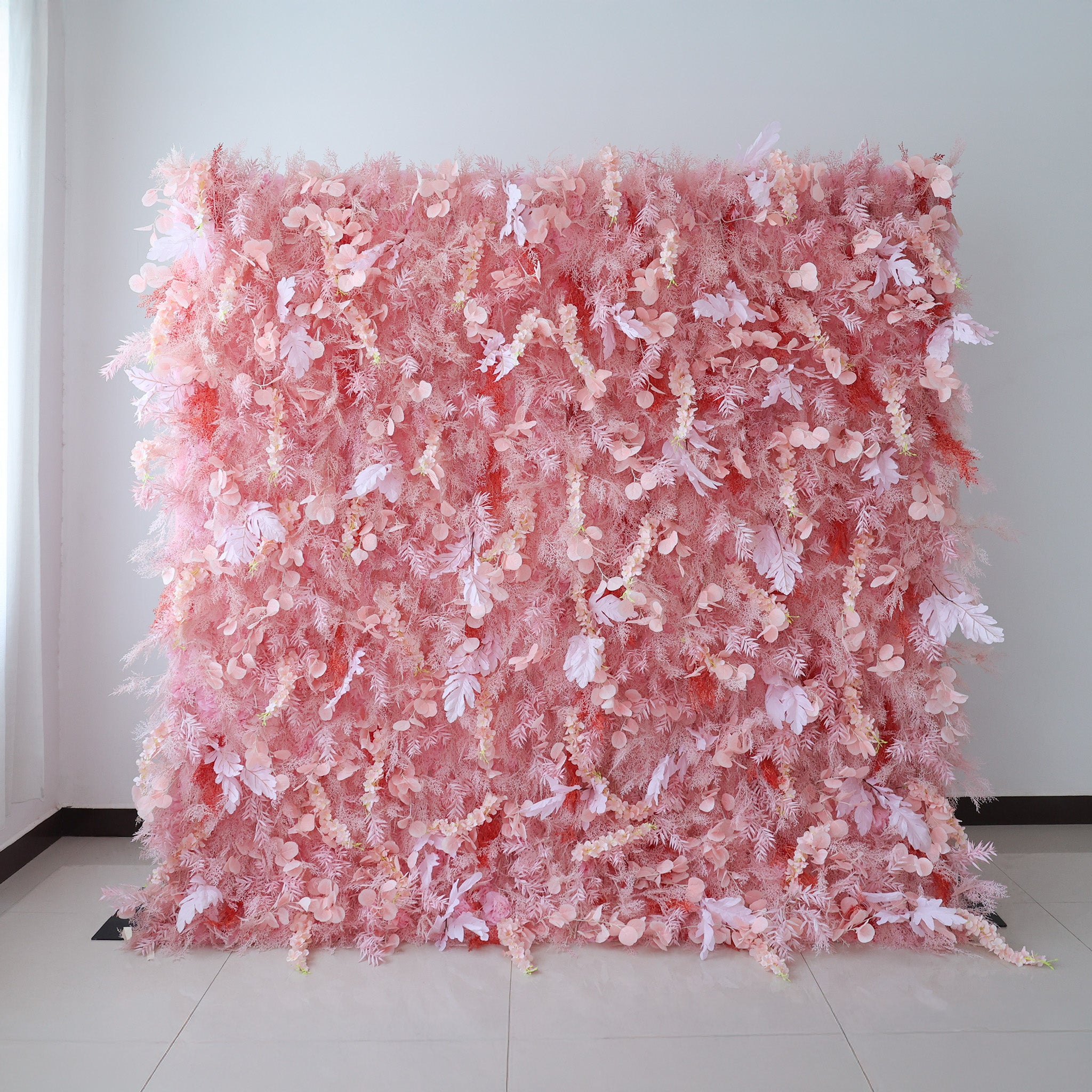 This image showcases a large, dense floral wall indoors. It&
