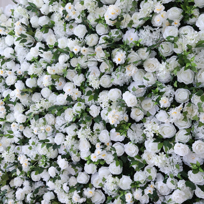 This image presents a dense, vibrant arrangement of artificial white flowers, predominantly roses, interspersed with lush green leaves. The flowers form a rich, elegant tapestry, exuding purity and charm. Ideal for decorative use in events or as an eye - catching interior backdrop, the scene combines pristine white hues and natural - looking foliage to create a visually appealing floral display.
