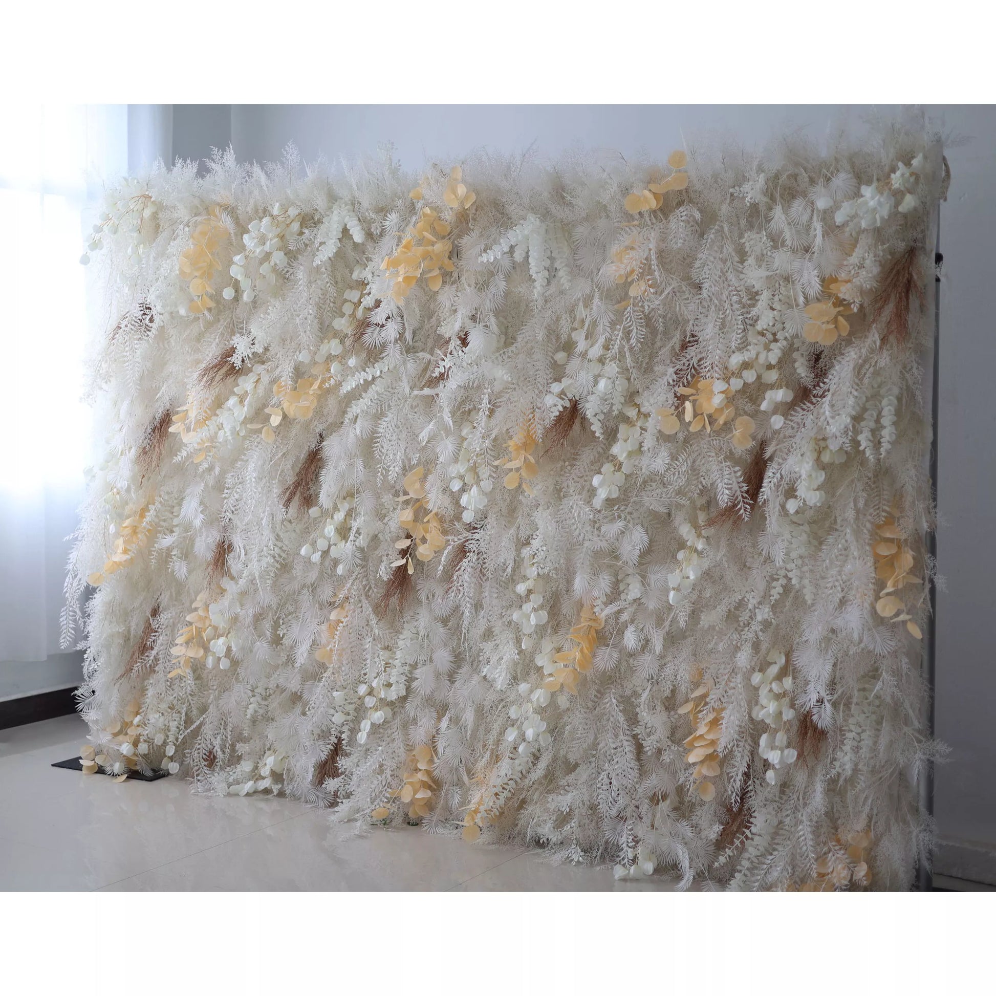 Valar Flowers' Artificial Fabric Flower Wall presents an enchanted snowscape. Icy whites converge with radiant golden petals, crafting a dreamy backdrop perfect for regal events and timeless celebrations.