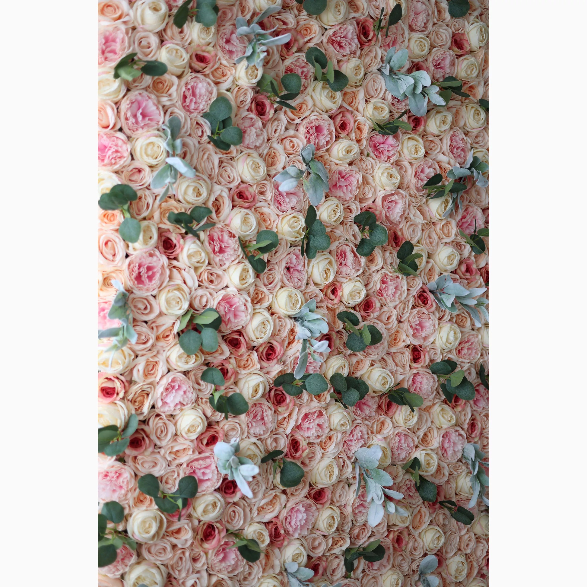 A large artificial flower wall features a harmonious mix of soft - pink, peach, and cream roses. Interspersed are green eucalyptus leaves and light - toned foliage, adding texture. The dense, layered arrangement creates a lush, romantic backdrop, ideal for adding elegance to events. 
