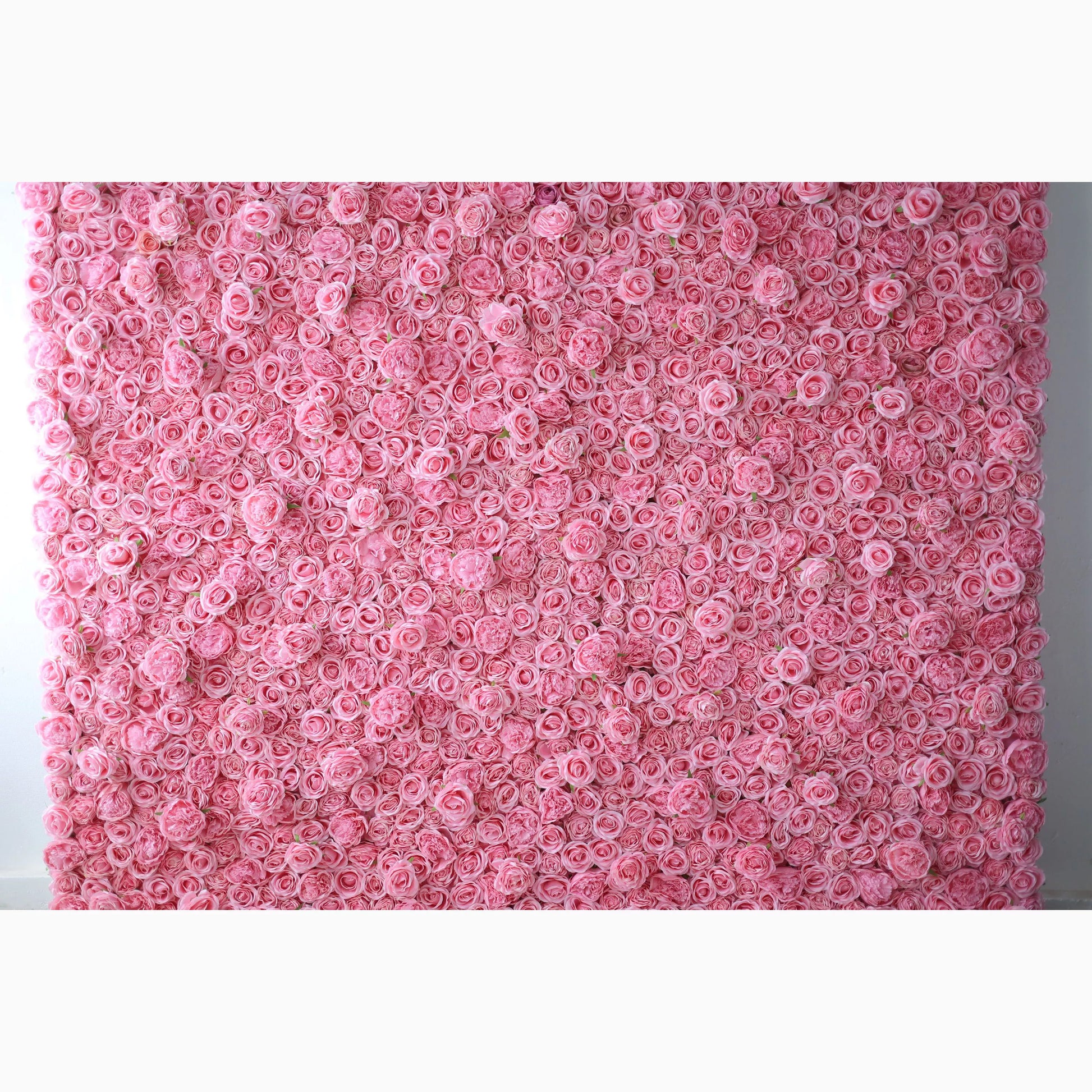 A vast artificial flower wall features a dense arrangement of uniform pink roses. Each bloom is tightly clustered, creating a smooth, lush, and romantic texture. The consistent soft - pink hue exudes a gentle, elegant, and dreamy vibe, perfect for adding a sweet, charming touch to decor or event backdrops. 