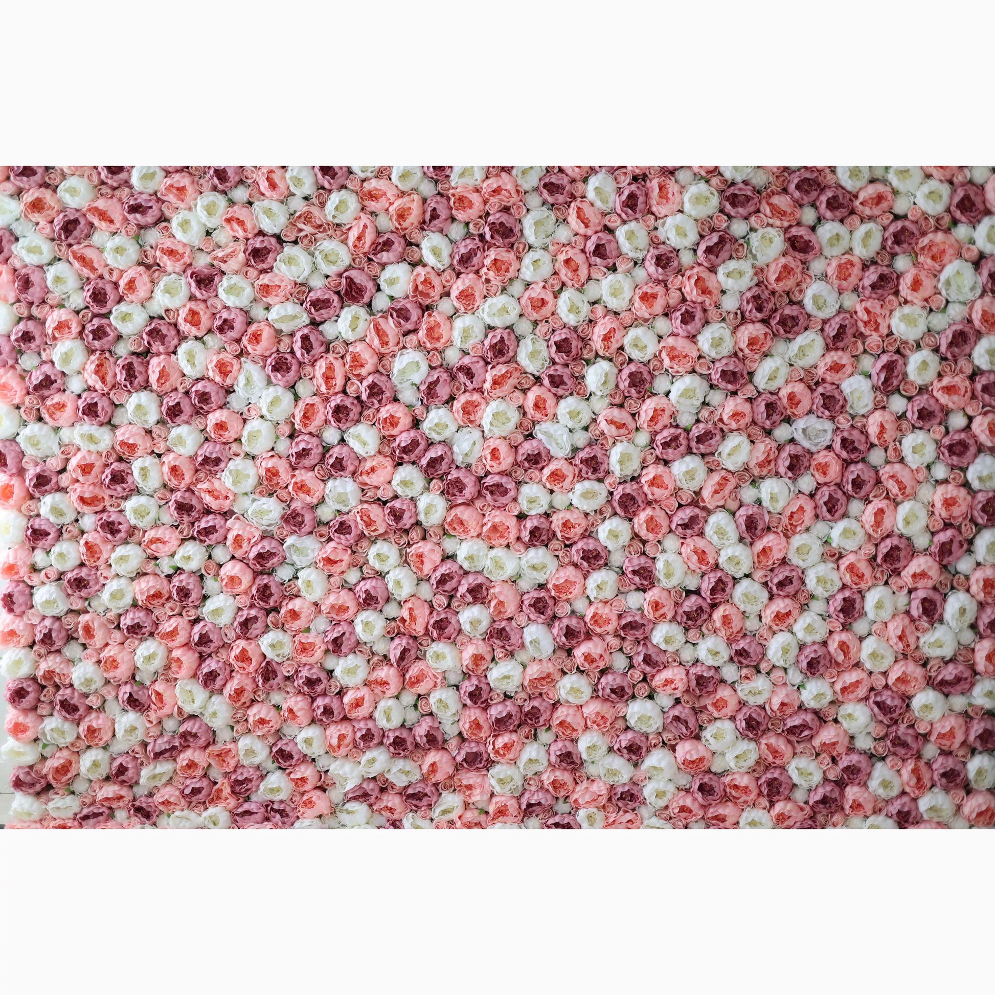 A large artificial flower wall showcases a captivating pattern of pink, white, and light pink roses. The blooms are densely packed, creating a lush, textured, and visually striking backdrop. The harmonious color blend gives off a romantic, elegant vibe, perfect for adding a decorative touch to events or spaces. 
