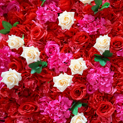 This close-up from Valar Flowers features a lush, vibrant floral arrangement. Creamy white roses stand out against a dense backdrop of deep red roses and bright pink hydrangeas, with green leaves adding contrast. The dense, layered design creates a rich, three-dimensional texture, evoking a bold, romantic, and naturally elegant atmosphere ideal for weddings, photo backdrops, or elegant celebrations.