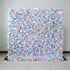 This image showcases a large, square floral wall indoors. It&