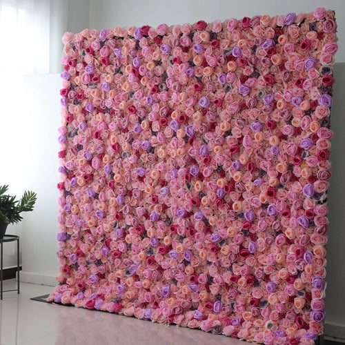 Valar Flowers' Serene Blossom Retreat: This is a large artificial flower wall, a vibrant mix of soft pink, peach, purple blooms, and red blossoms. Densely packed, it creates a lush, romantic texture. Ideal for event backdrops, it exudes elegance, with the harmonious color blend bringing a dreamy, charming atmosphere. 