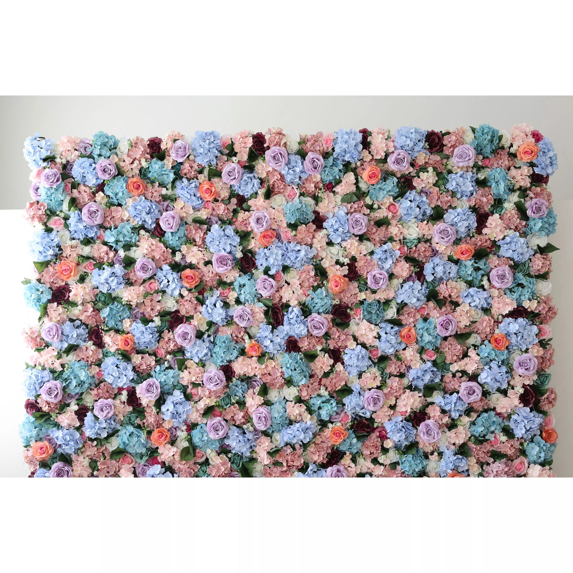 This large artificial flower wall showcases a lush blend of blue hydrangeas, purple roses, peach blooms, and greenery. The dense, vibrant arrangement creates a romantic, eye - catching display, perfect for event backdrops, adding an elegant, dreamy charm to the space. 