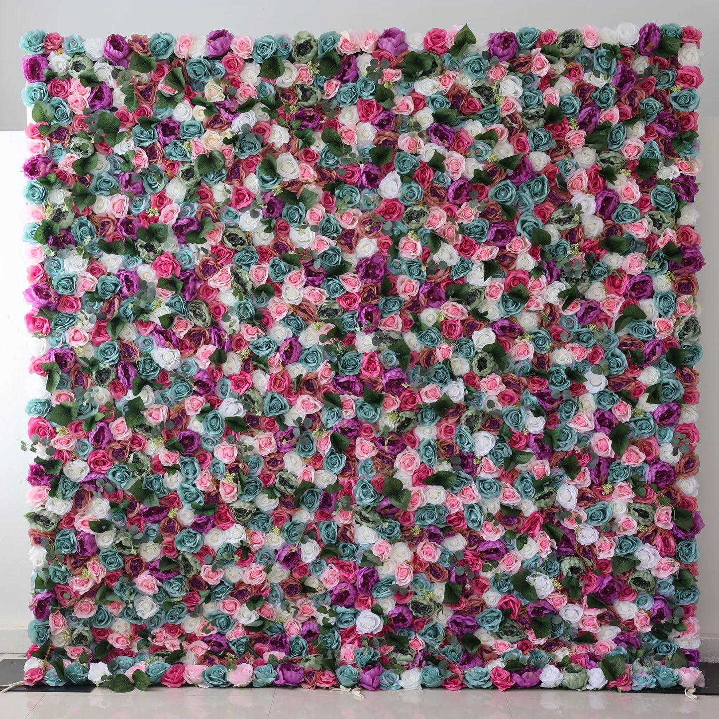 Valar Flowers Presents: This large artificial flower wall is a vibrant tapestry of colors. It features an array of roses in shades of pink, purple, white, teal, and more, interspersed with green foliage. The dense, intricate arrangement creates a lush, eye - catching display, perfect for adding a romantic, decorative touch to events or spaces. 