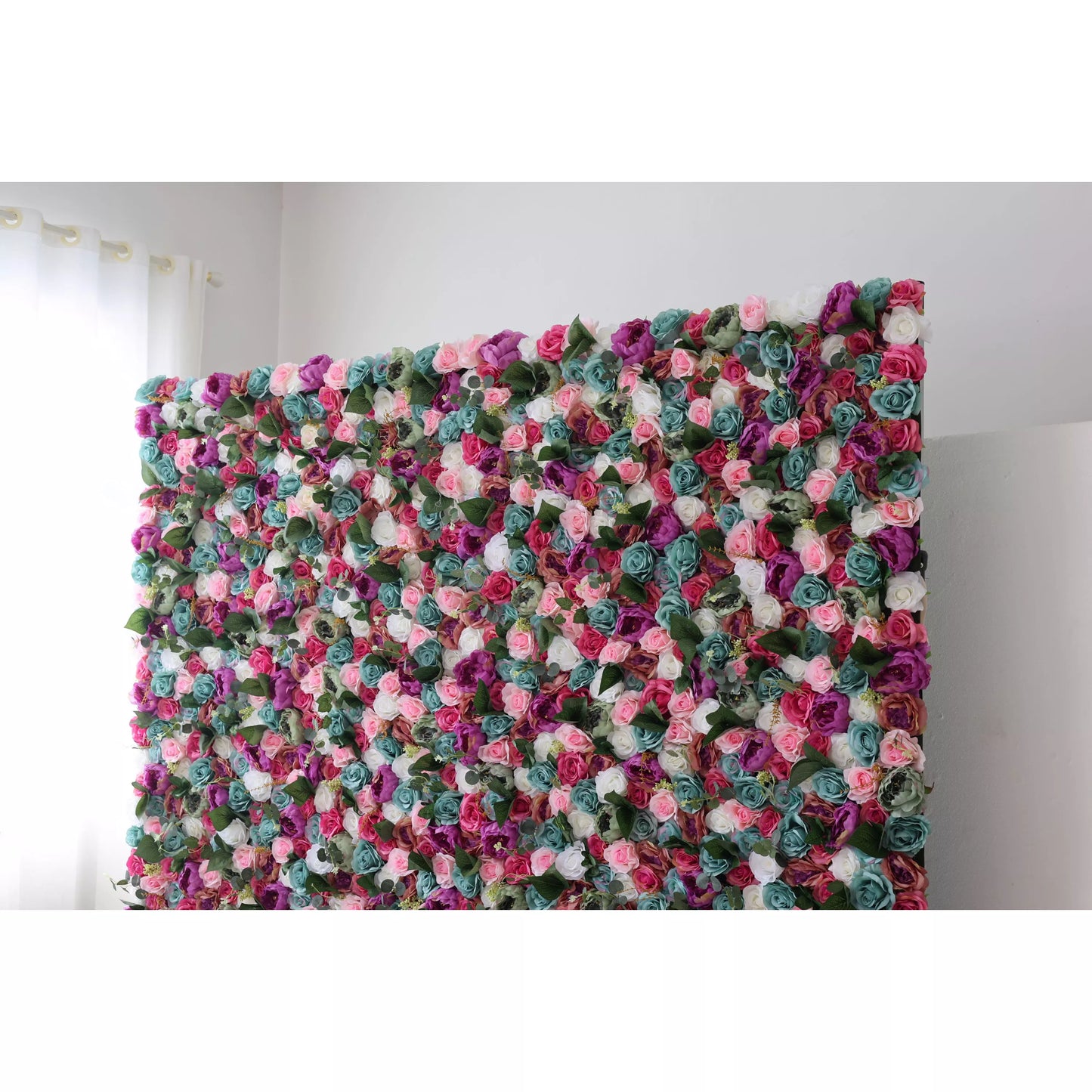 This large artificial flower wall is a vibrant mix of pink, purple, teal, and white blooms, interspersed with green foliage. The dense, colorful arrangement creates a lush, eye - catching display, perfect for adding a romantic, decorative touch to events or spaces. 