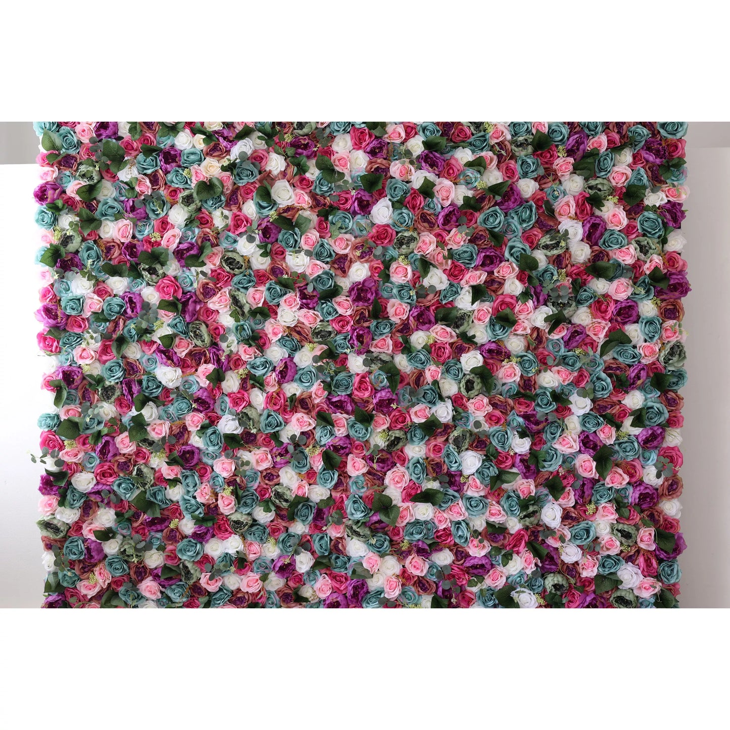 This large artificial flower wall is a vibrant tapestry of colors. It features an array of roses in shades like pink, purple, teal, and white, interspersed with green foliage. The dense, intricate arrangement creates a lush, eye - catching display, perfect for adding a romantic, decorative touch to events or spaces. 