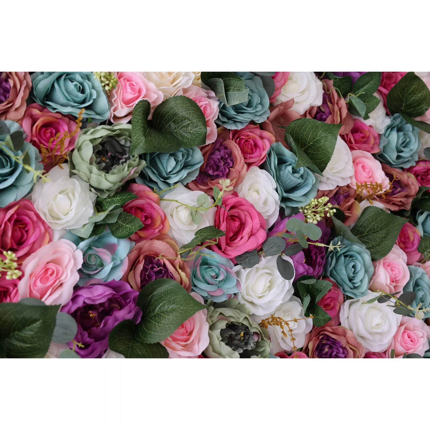 This close - up features a lush artificial flower wall with roses in pink, teal, white, and purple, plus green foliage. The varied blooms and leaves create a vibrant, romantic texture, perfect for adding an elegant, dreamy touch to decor or backdrops. 
