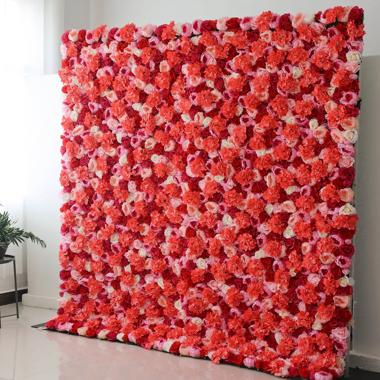 Valar Flowers' Crimson Cascade: A large artificial flower wall bursts with color! Dense clusters of blooms in shades of coral, pink, white, and deep red create a vibrant, eye - catching display. The mix of flower types and rich hues forms a lush, romantic backdrop, perfect for adding a lively, decorative touch to events or spaces. 