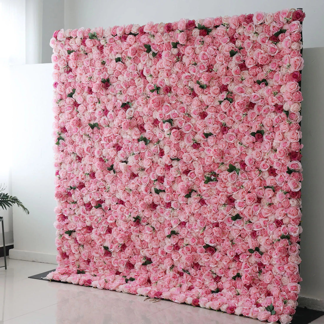This is a large artificial flower wall covered with dense, soft - pink roses. The uniform arrangement creates a lush, romantic and elegant look, perfect as a backdrop for events like weddings or photo shoots, adding a touch of sweetness and charm to the space.