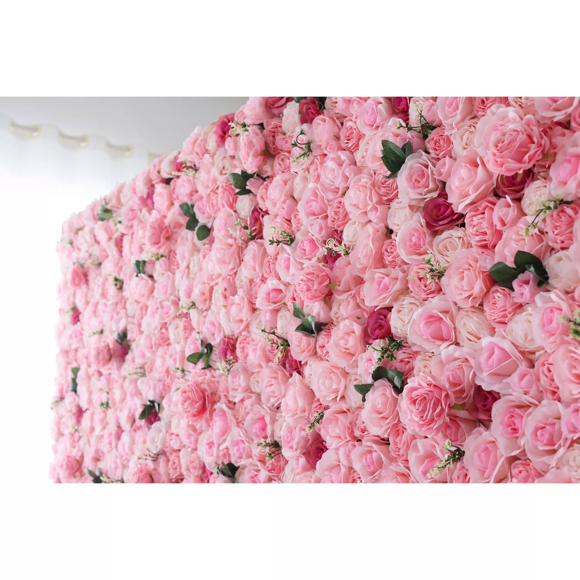 This is a large, curved artificial flower wall. It’s densely covered with soft - pink roses, interspersed with green leaves and darker - hued rose buds. The lush, uniform arrangement creates a romantic, elegant atmosphere, perfect as a backdrop for weddings, photo shoots, or other events, adding a sweet and charming touch. 