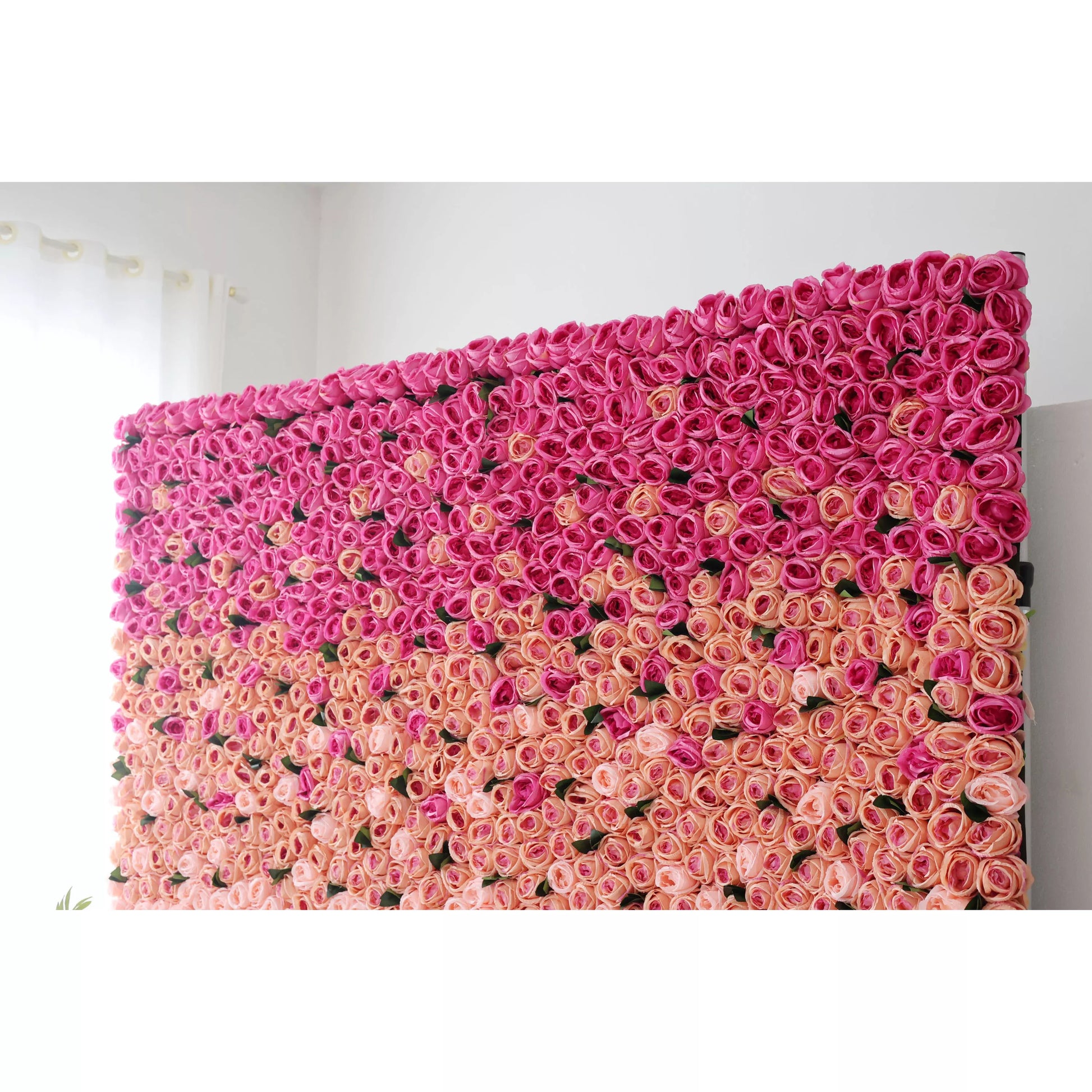 This picture showcases a large artificial flower wall, a beautiful gradient of pink tones. It’s densely packed with rose - like blooms, transitioning from deep pink at the top to soft pink at the bottom. The uniform, lush arrangement creates a romantic, eye - catching display, perfect for event backdrops. The vibrant colors and dense floral pattern add a touch of elegance and charm to any space, making it an ideal decorative element for weddings or parties. 