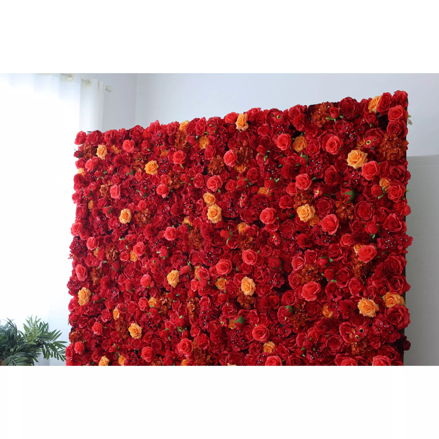 Red and orange artificial rose wall backdrop by ValarFlowers for weddings and event photography decor