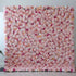 This flower wall is a lush, romantic display of artificial blooms. A soft pink base, dotted with peach - colored roses, deeper pink blossoms, and white flowers, creates a dreamy, textured pattern. The dense arrangement and gentle color palette make it perfect for weddings or elegant events, exuding charm and warmth. 
