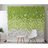 This is a decorative flower wall made of artificial roses, featuring a gradient from green to white. In front of it are a small white round table and a white chair with wooden legs. Ideal for photo backdrops or event decor, creating a fresh and elegant atmosphere. 