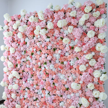 This image showcases a lush floral backdrop by ValarFlowers, featuring a dense arrangement of artificial flowers in shades of pink, peach, and white. The textured display exudes elegance, perfect for adding a luxurious, nature-inspired element to events or interiors, with its vibrant and sophisticated design.