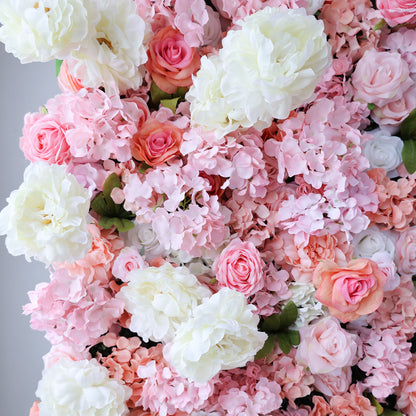 This image showcases a lush floral backdrop by ValarFlowers, featuring a dense arrangement of artificial flowers in shades of pink, peach, and white, including roses and hydrangeas. The textured display exudes elegance, perfect for adding a luxurious, nature-inspired element to events or interiors, highlighting the brand’s craftsmanship in vibrant, sophisticated decor.