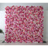 This flower wall is a vibrant, multi - hued display of artificial blooms. It blends pink, white, and purple roses, plus delicate flowers, creating a lush, textured pattern. The dense arrangement and varied colors evoke a cheerful, romantic vibe, perfect for weddings or events, offering a captivating backdrop for photos. 