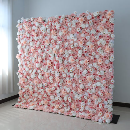A large, square floral wall displays a vibrant mix of pink, blush, and white artificial flowers. Dense clusters of roses, peonies, and smaller blooms create a lush, romantic look. Set in a room with light - colored walls, a tiled floor, and a window with sheer curtains, it exudes elegance, perfect for weddings, photo backdrops, or upscale events needing a charming floral focal point.