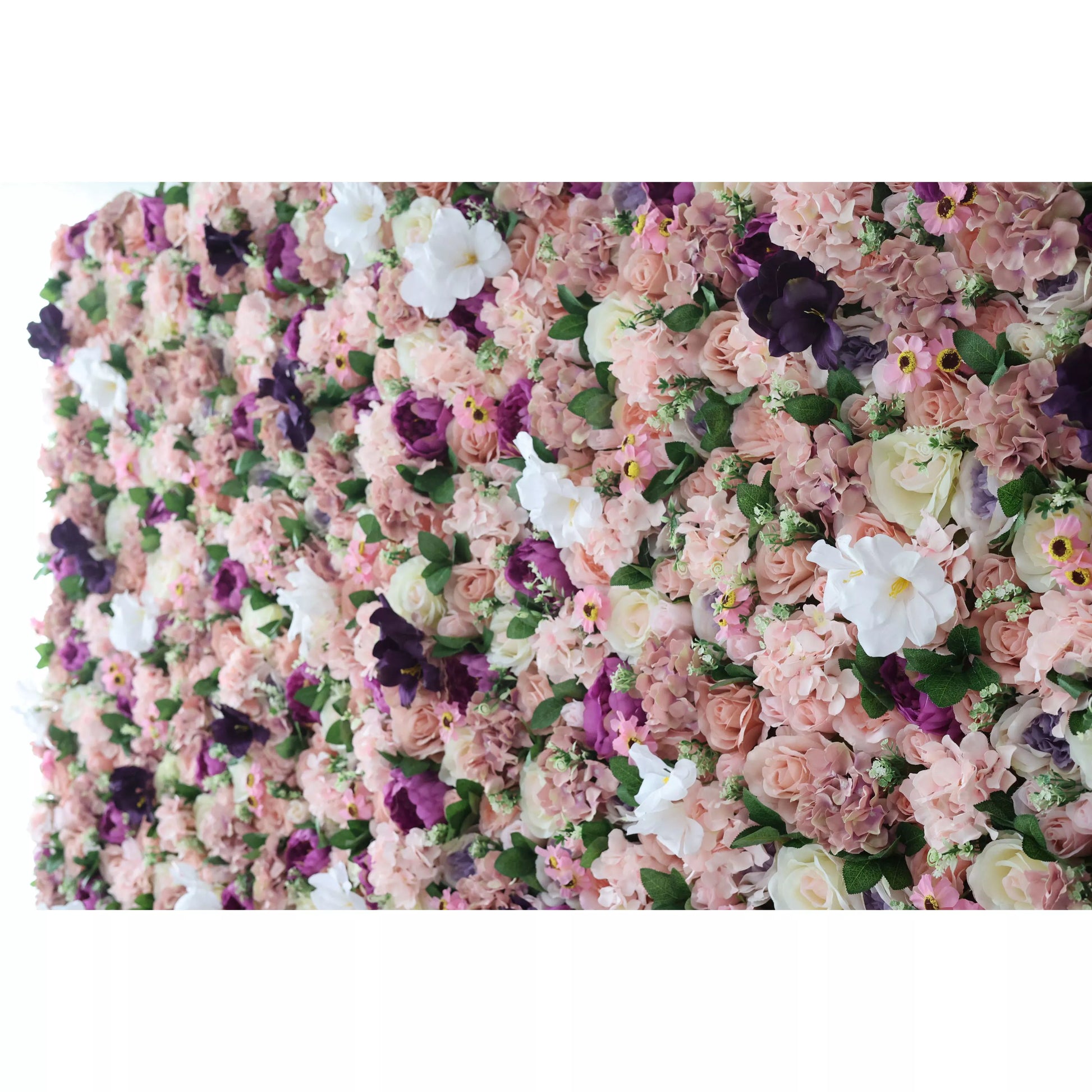 This intimate close-up showcases a lush, textured arrangement of artificial blooms in a romantic palette of blush, dusty rose, deep plum, and crisp white. It features hydrangeas, roses, pansies, and delicate filler flowers, layered with fresh-looking green leaves for a velvety, three-dimensional effect. The rich, vintage-inspired mix exudes warmth and elegance, making it a luxurious backdrop for weddings, photoshoots, or upscale events.