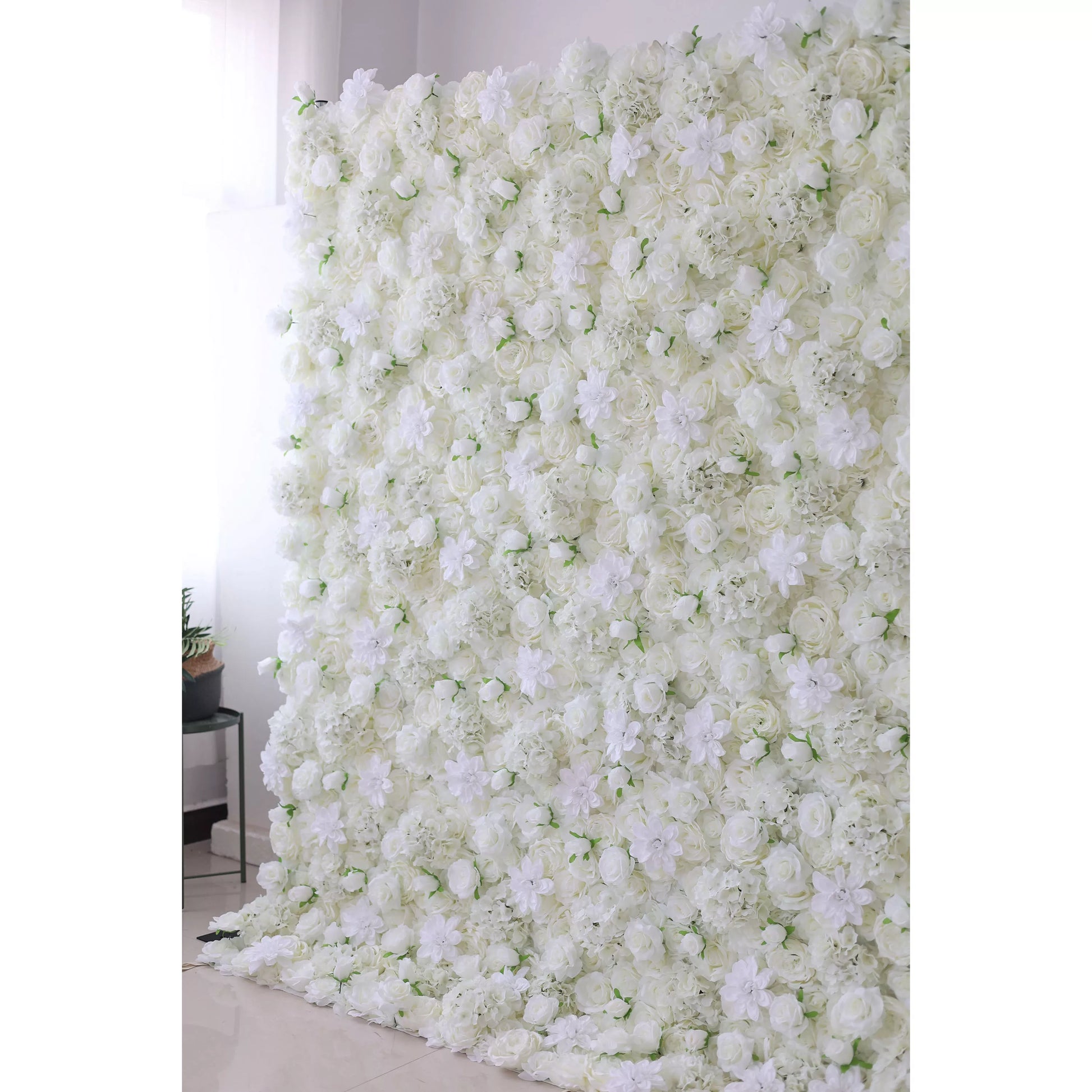 This flower wall is a grand, all - white creation. It features an abundance of roses, delicate blooms, and greenery, forming a thick, textured surface. Ideal for weddings or elegant events, its pure white tones and lush arrangement bring a sense of romance and luxury, serving as a perfect photo - worthy backdrop. 