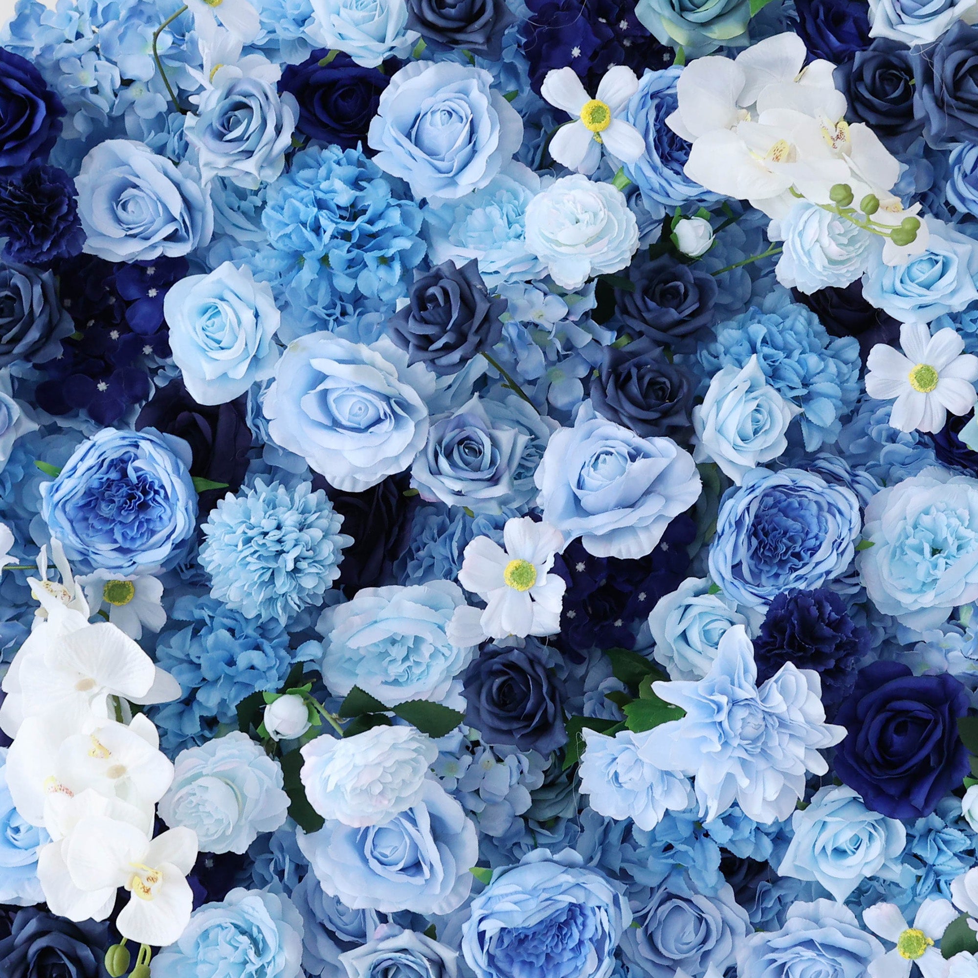 This close - up image showcases a dense arrangement of artificial flowers in various shades of blue and white. The flowers, including roses and other blooms, are clustered tightly to form a lush, elegant floral display. The harmonious blend of colors, from light blue to deep navy, along with the intricate petals, creates a serene and refined scene, ideal for decorative purposes in events or as a visually appealing artistic display.