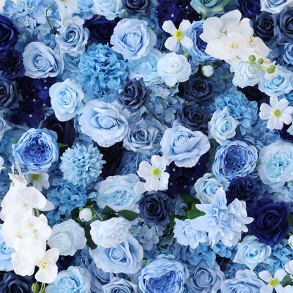 This close - up image showcases a dense arrangement of artificial flowers in various shades of blue and white. The flowers, including roses and other blooms, are clustered tightly to form a lush, elegant floral display. The harmonious blend of colors, from light blue to deep navy, along with the intricate petals, creates a serene and refined scene, ideal for decorative purposes in events or as a visually appealing artistic display.