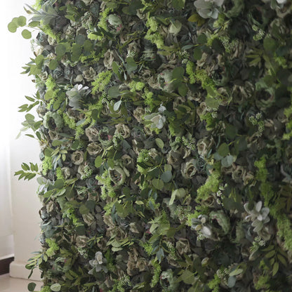 The image shows a lush, green wall adorned with a variety of flowers and foliage. The wall is densely covered with different types of green leaves and blooms, creating a rich and vibrant display. The flowers are interspersed among the greenery, adding pops of color to the overall green backdrop.