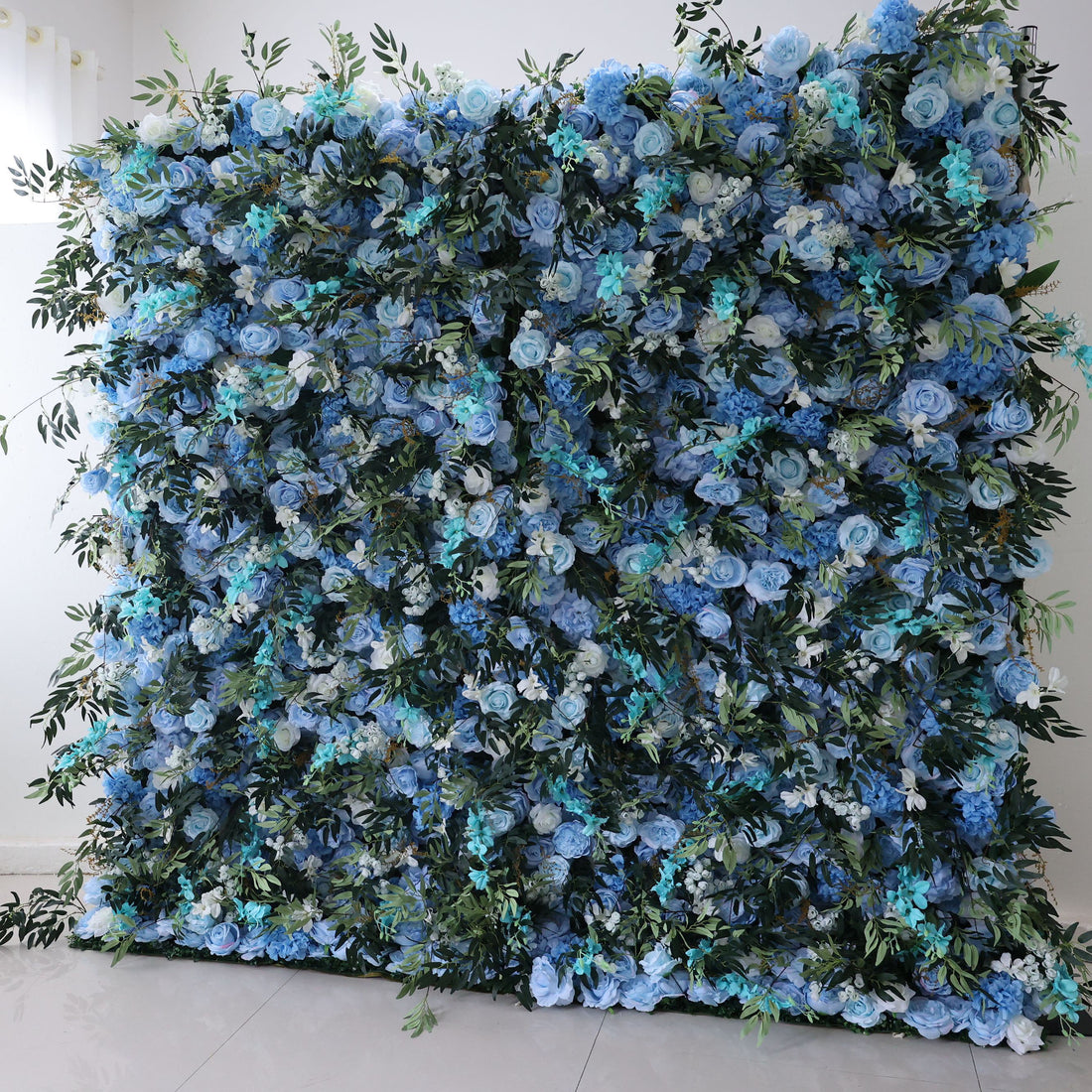 ValarFlowers Backdrop: Delve into Enchanted Bluewood, where deep blue roses meet lush green foliage. Transport your event to whimsical woodlands with this masterpiece.