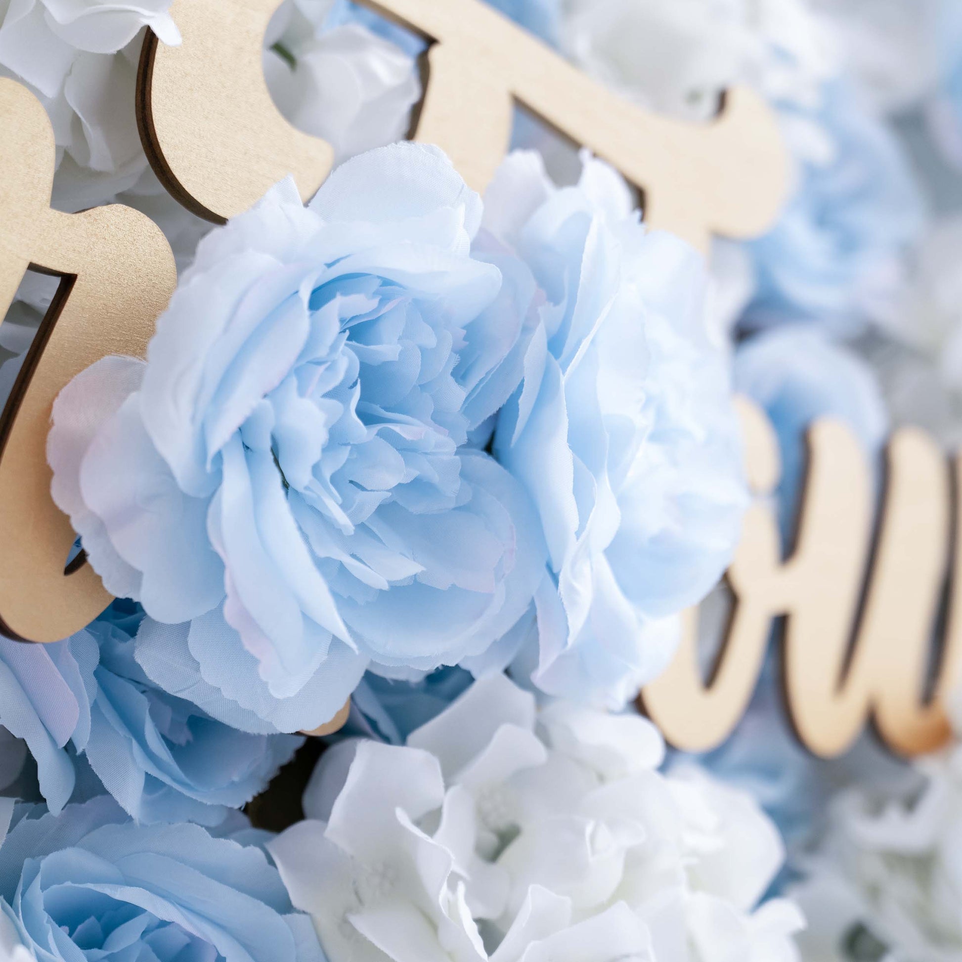 The ValarFlowers artificial flower wall is perfect for weddings. It features a beautiful blend of blue and white flowers, creating a romantic and elegant backdrop for the special day.