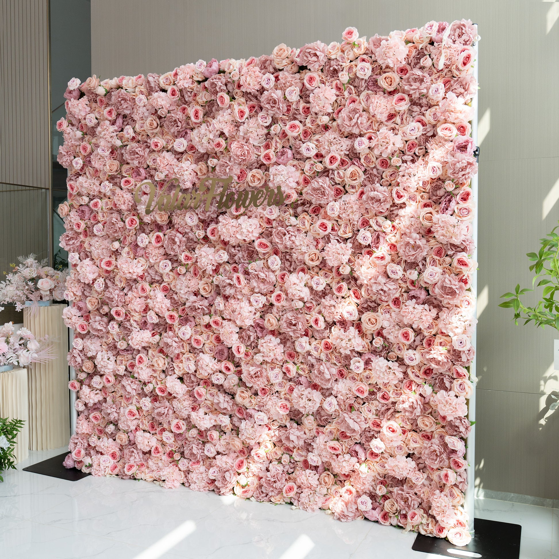 Yes, the floral arrangement can likely be customized. The images show a variety of floral walls with different colors and flower types, indicating that the arrangements can be tailored to specific preferences or themes. Whether it's changing the color scheme, type of flowers, or the overall design, customization options seem to be available to suit various events and aesthetics.